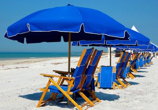 1 umbrella and 2 beach chairs